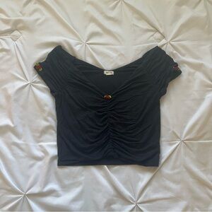 Garage black ruched crop top with cute red rosette detailing